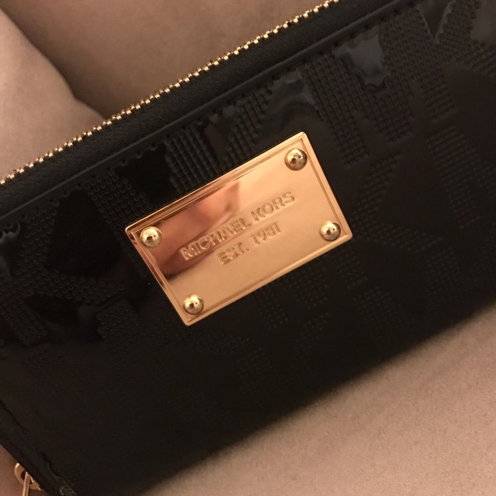 Michael Kors pat and leather logo wristlet.